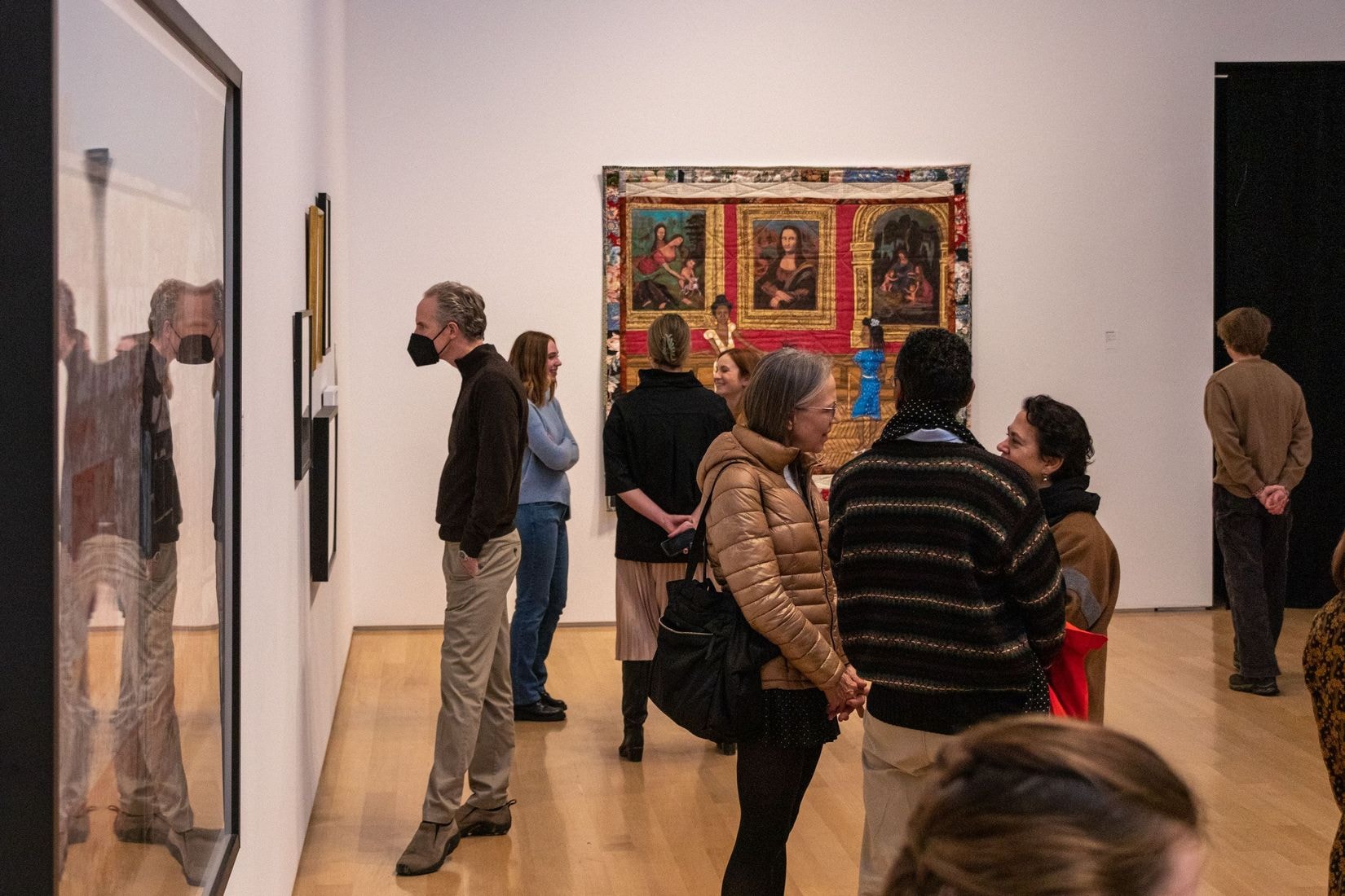 People in the Gallery looking at art and mingling.