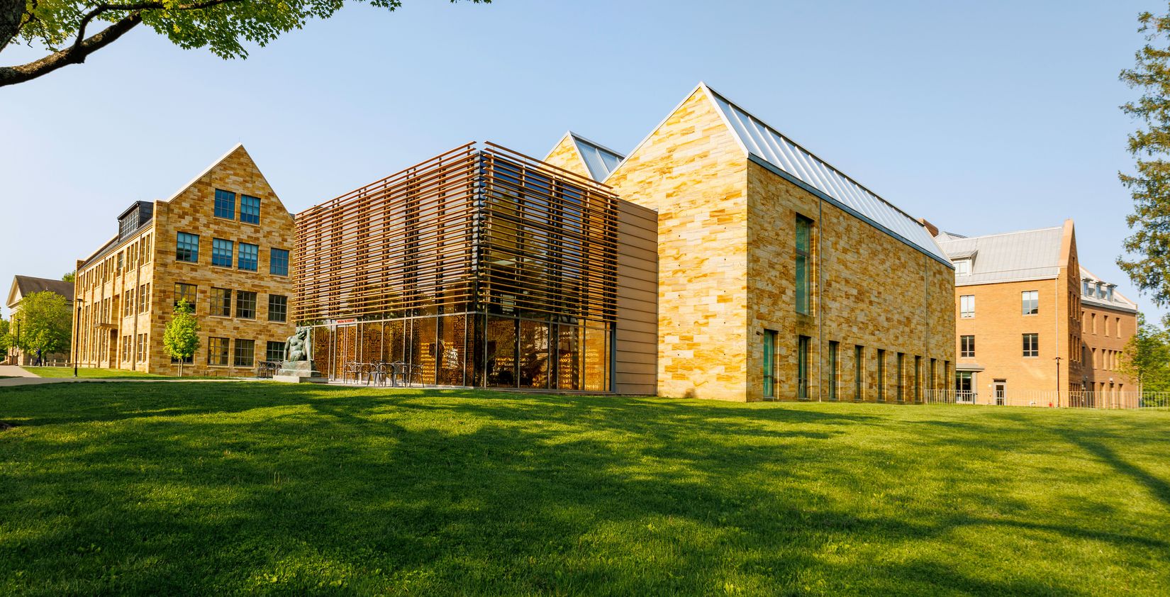 A wide angle view of the exterior of the Gund Gallery with part of Chalmers Library visible.