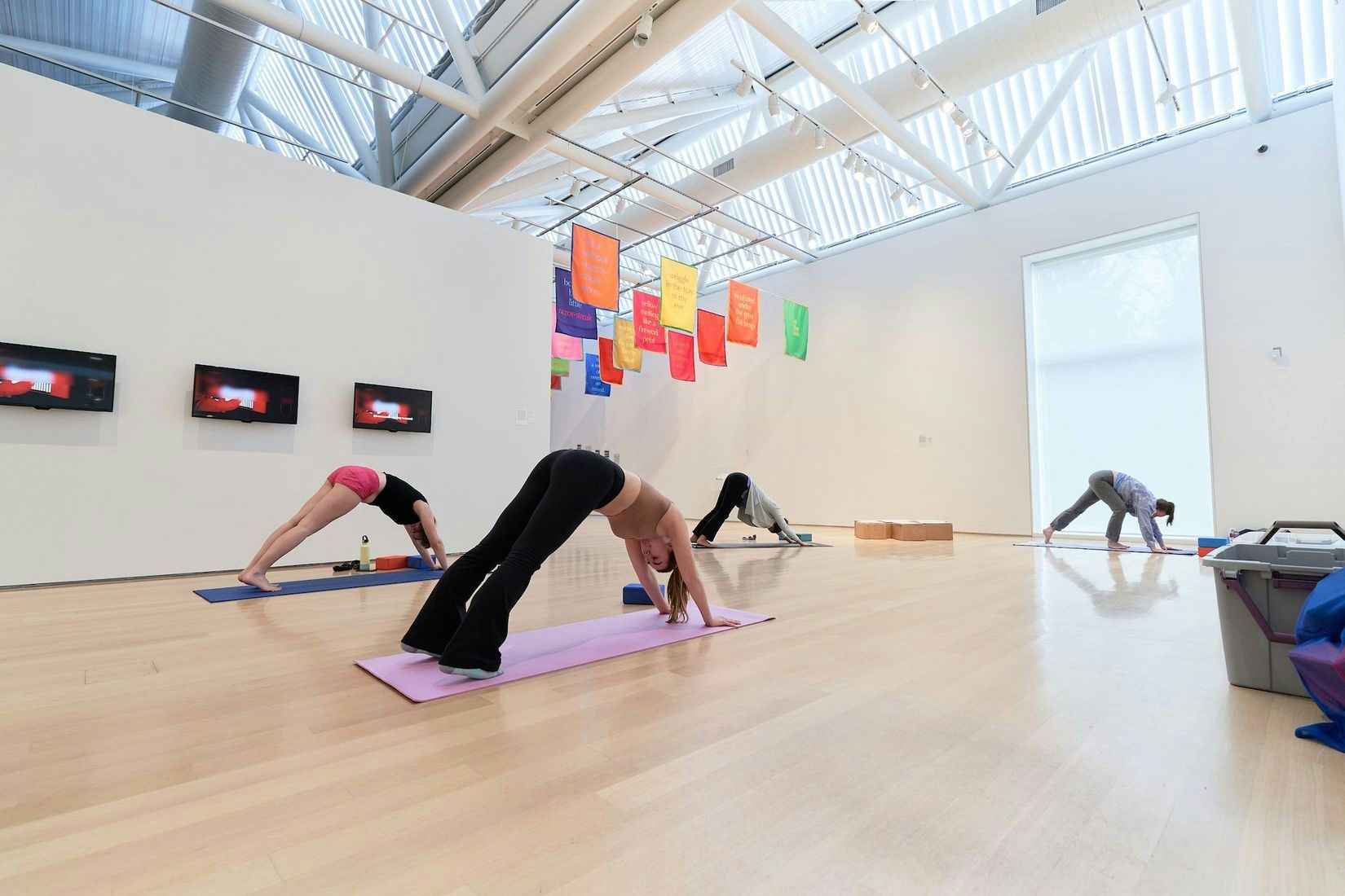 View of a group doing Yoga at the Gund Gallery
