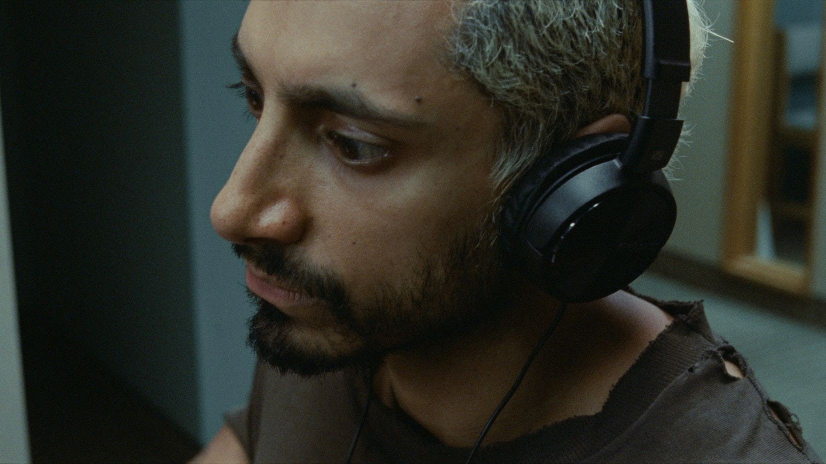 A close up of Riz Ahmed as drummer Ruben Stone in Sound of Metal. 
